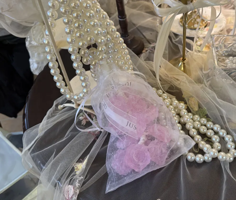 Pink grape soap in an organza bag with pearls